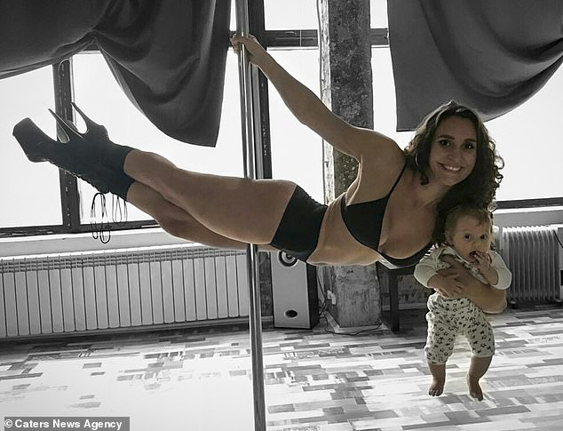 Pole dancer, 24, who continued to dance while pregnant shows off her moves while carrying her newborn baby in Belarus